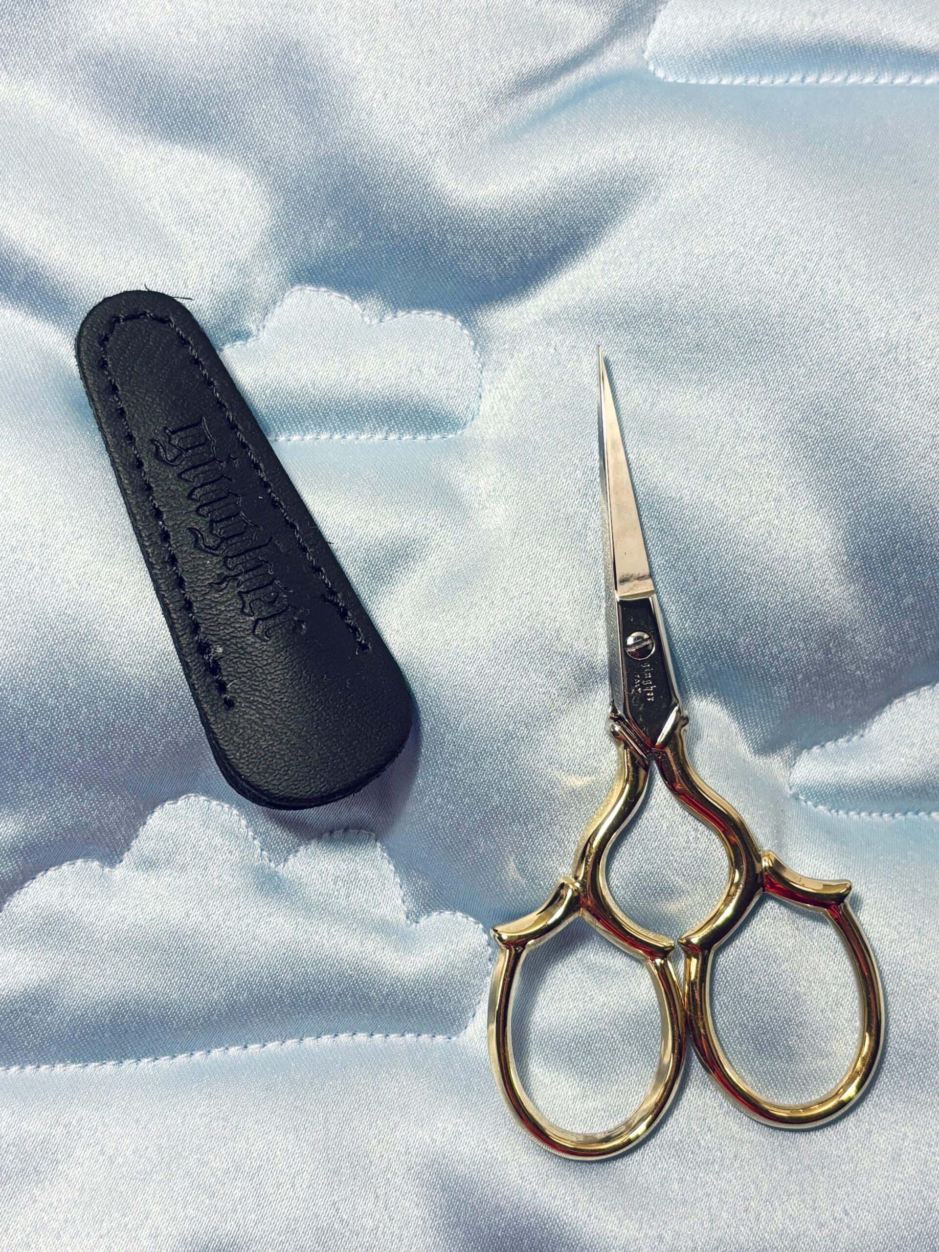 A small embroidery scissor with a sharp narrow tip that is useful to cut threads and trim at higher precision.