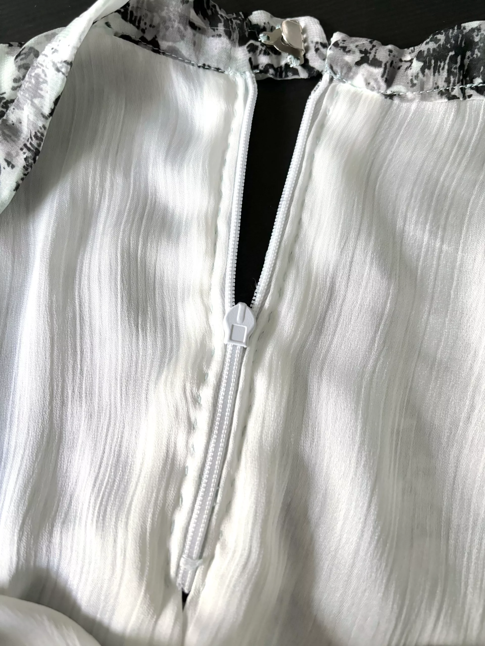 A close-up view of the inside back of the circle skirt, showing the hand-stitched lining.