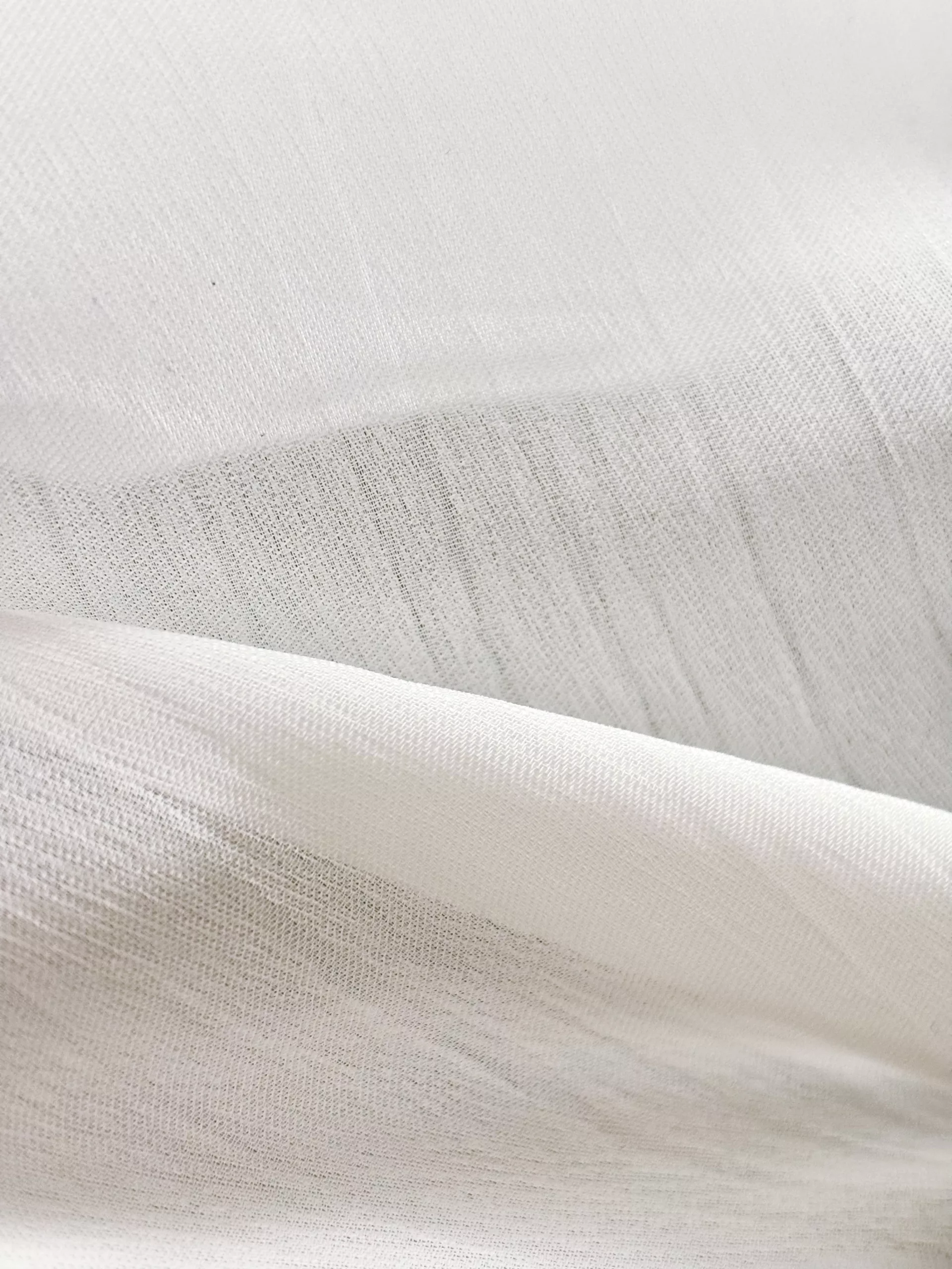 A close-up of the white shimmery lining fabric.